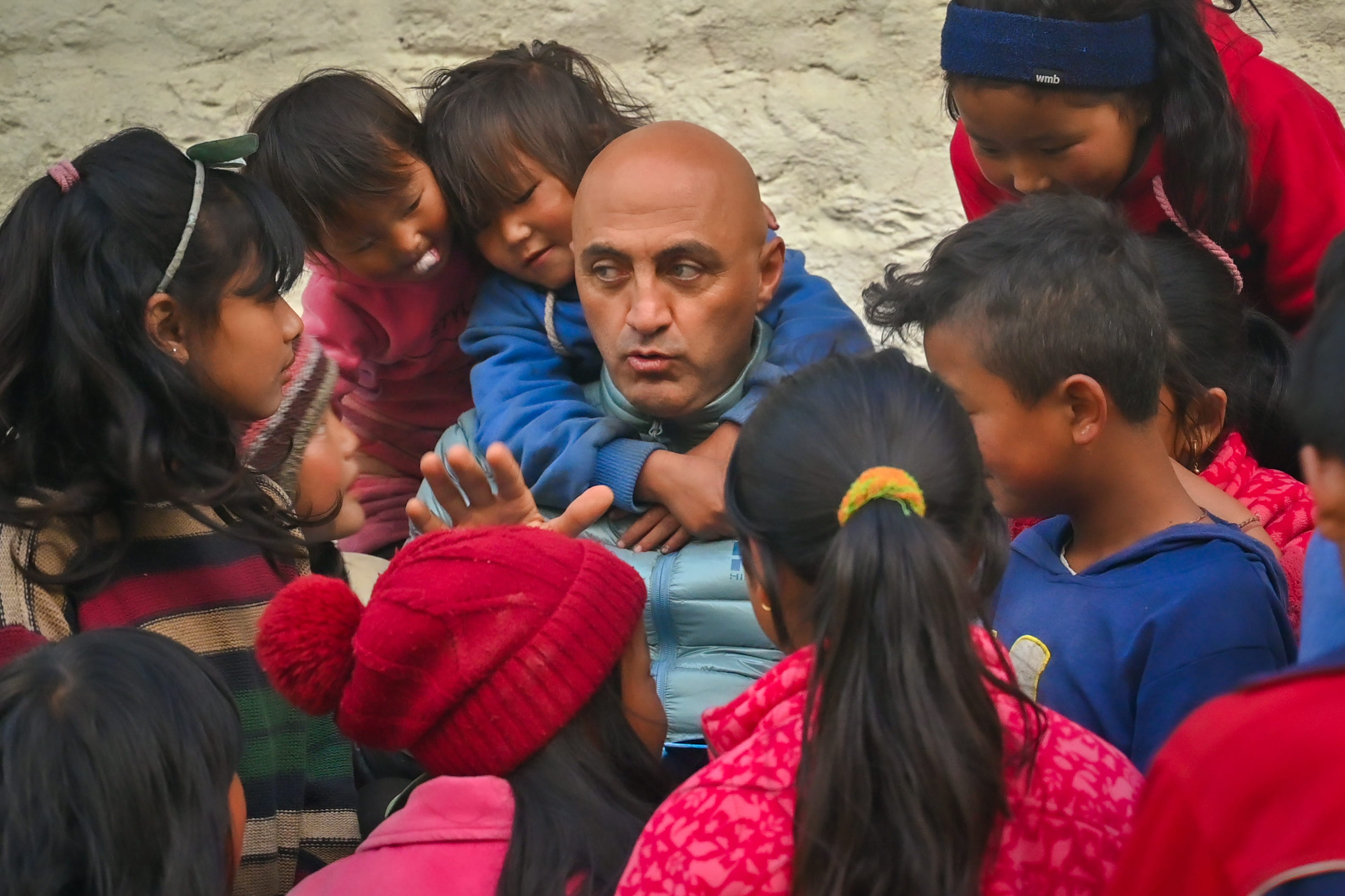 Mostafa surrounded by Nepali children